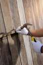 Construction man workers in blue shirt with Protective gloves working with hammer Royalty Free Stock Photo