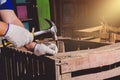 Construction man workers in blue shirt with Protective gloves working with hammer Royalty Free Stock Photo