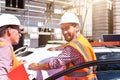 Construction manager and architect on site during the construction of a house - planning and control on site - teamwork Royalty Free Stock Photo