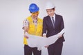 Construction manager and engineer looking at blueprints Royalty Free Stock Photo