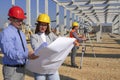 Construction Project Manager And Young Female Architect Checking The Blueprint On Construction Site Royalty Free Stock Photo