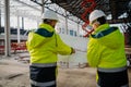 Construction managers reviewing blueprints or project plans. Royalty Free Stock Photo