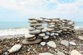 Construction of many pebbles on a sea coast