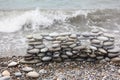 Construction of many pebbles on a sea coast