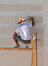 Construction mason renovating the facade of a house Royalty Free Stock Photo