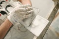 Construction mason worker with spatula and mortar Royalty Free Stock Photo