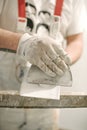 Construction mason worker with spatula and mortar Royalty Free Stock Photo