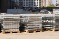 Construction Materials. Building materials for construction of residential complex. Pile of gray bricks at construction site