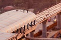 Construction men standing on the roof of a metro station in Delh