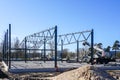 Construction of a metal truss frame for a new production building Royalty Free Stock Photo