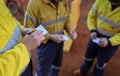 Construction miner workers conducting self risk assessment call as take five step prior to work