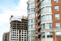 Construction and modern condo buildings with huge windows and balconies in Montreal