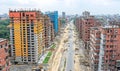 aerial view of urban construction site with high rise buildings and road development in a densely populated city area Royalty Free Stock Photo