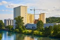 Construction of a modern processing complex on the river bank. The complex for storage, drying, processing of grain, flour, wheat Royalty Free Stock Photo