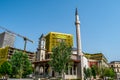 Construction of a modern skyscraper around the Et'hem Bej Mosque in Tirana Royalty Free Stock Photo