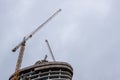 Construction of modern skyscraper building with luxury apartments against sky. Residential development. Royalty Free Stock Photo