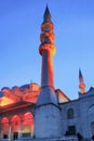 ISTANBUL, TURKEY - MARCH 24, 2012: Illuminated minaret of New mosque.