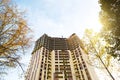 Construction of a multi-storey apartment building in the city. A crane near a skyscraper. Building, moving to a new flat, mortgage Royalty Free Stock Photo