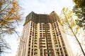 Construction of a multi-storey apartment building in the city. A crane near a skyscraper. Building, moving to a new flat, mortgage Royalty Free Stock Photo