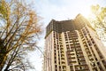 Construction of a multi-storey apartment building in the city. A crane near a skyscraper. Building, moving to a new flat, mortgage Royalty Free Stock Photo