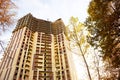 Construction of a multi-storey apartment building in the city. A crane near a skyscraper. Building, moving to a new flat, mortgage Royalty Free Stock Photo