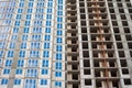 The construction of a multi-storey building in the city. one house at different stages Royalty Free Stock Photo