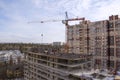 Construction of a multi-storey building, a crane at a construction site Royalty Free Stock Photo