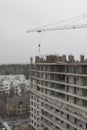 Construction of a multi-storey building, a crane at a construction site Royalty Free Stock Photo