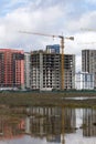 Construction of multi-storey buildings. Modern multi-storey building. Houses with reinforced concrete frame. Work construction Royalty Free Stock Photo