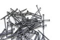 Construction nails, a large amount of nails on a white background Royalty Free Stock Photo