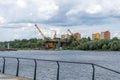 Construction of a new bridge across the river.Embankment of the Vistula River in Warsaw. Sky with clouds. Outdoor