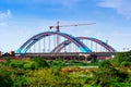 Construction of a new bridge with a high construction crane Royalty Free Stock Photo