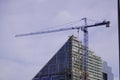 Construction of a new building, crane, construction, work of people. new housing or offices Royalty Free Stock Photo