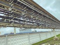 Construction of a new complex at the plant. metal structures for the erection of a new building behind a white metal fence. the