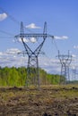 Construction of new high voltage lines in forest. Estonia. new mast of a high voltage power line. installation of a high Royalty Free Stock Photo