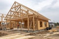 New home construction with wooden truss and post-beam framework Royalty Free Stock Photo