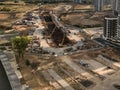 Construction of a new metro station. excavation of an underground tunnel with a large gantry crane. shooting from a height, aerial Royalty Free Stock Photo