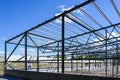Construction of a new modern industrial building, metal truss frame Royalty Free Stock Photo
