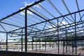 Construction of a new modern industrial building, metal truss frame Royalty Free Stock Photo