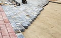 Construction of a new modern sidewalk made of tiles Royalty Free Stock Photo