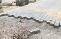 Construction of a new modern sidewalk made of tiles Royalty Free Stock Photo