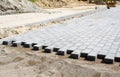 Construction of a new modern sidewalk made of tiles Royalty Free Stock Photo