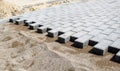 Construction of a new modern sidewalk made of tiles Royalty Free Stock Photo