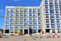 Construction of a new multi-storey building. Suspended cradle for works insulation of the facade of the mineral wool. Laying