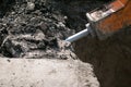 Construction of a new multi-storey building. The work of a jackhammer when laying the foundation