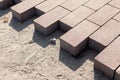 Construction of a new pavement of paving slabs closeup detail. Pavement cobblestone blocks construction of path, road or sidewalk.