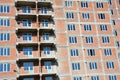 The construction of a new residential, apartment, high rise building with unfinished balconies. An multi storey building Royalty Free Stock Photo