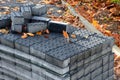 Construction of new residential area roadway. parking spaces are made of concrete perforated fittings. the surroundings are fenced