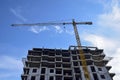 Construction of a new residential building  with use of tower crane. Real Estate, Residential Buildings Urban Mixed-Use Royalty Free Stock Photo