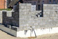 Construction of a new residential house from building blocks, insulation of foundations Royalty Free Stock Photo
